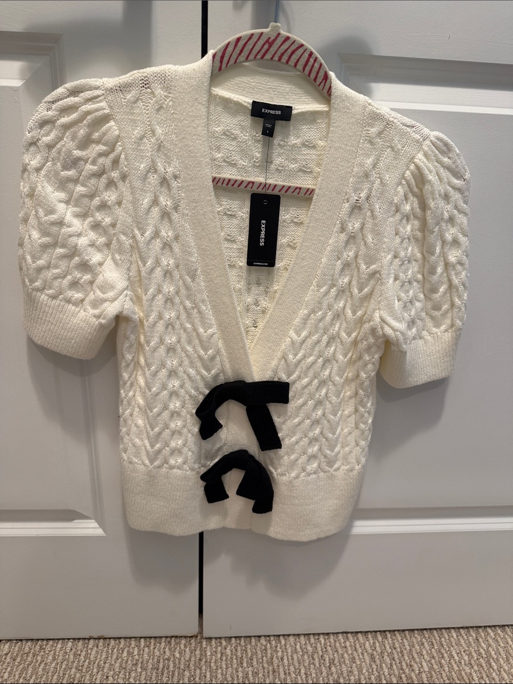Express Cream Cable-Knit V-Neck Sweater with Black Bow Accents